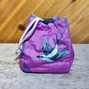 Purple quilted drawstring bag